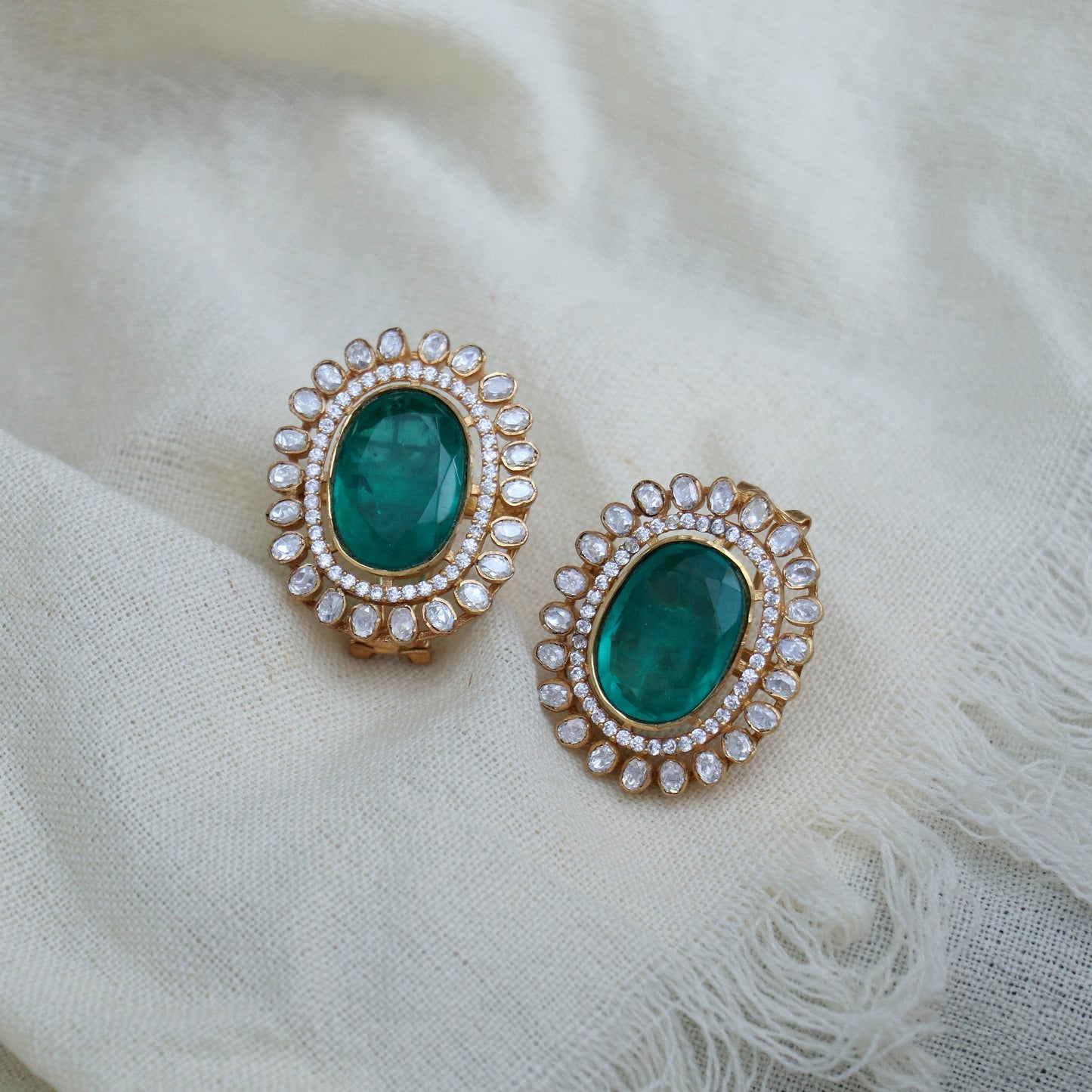 Emerald Green Oval Stud Earrings with Dual-Halo Kundan & CZ Detailing